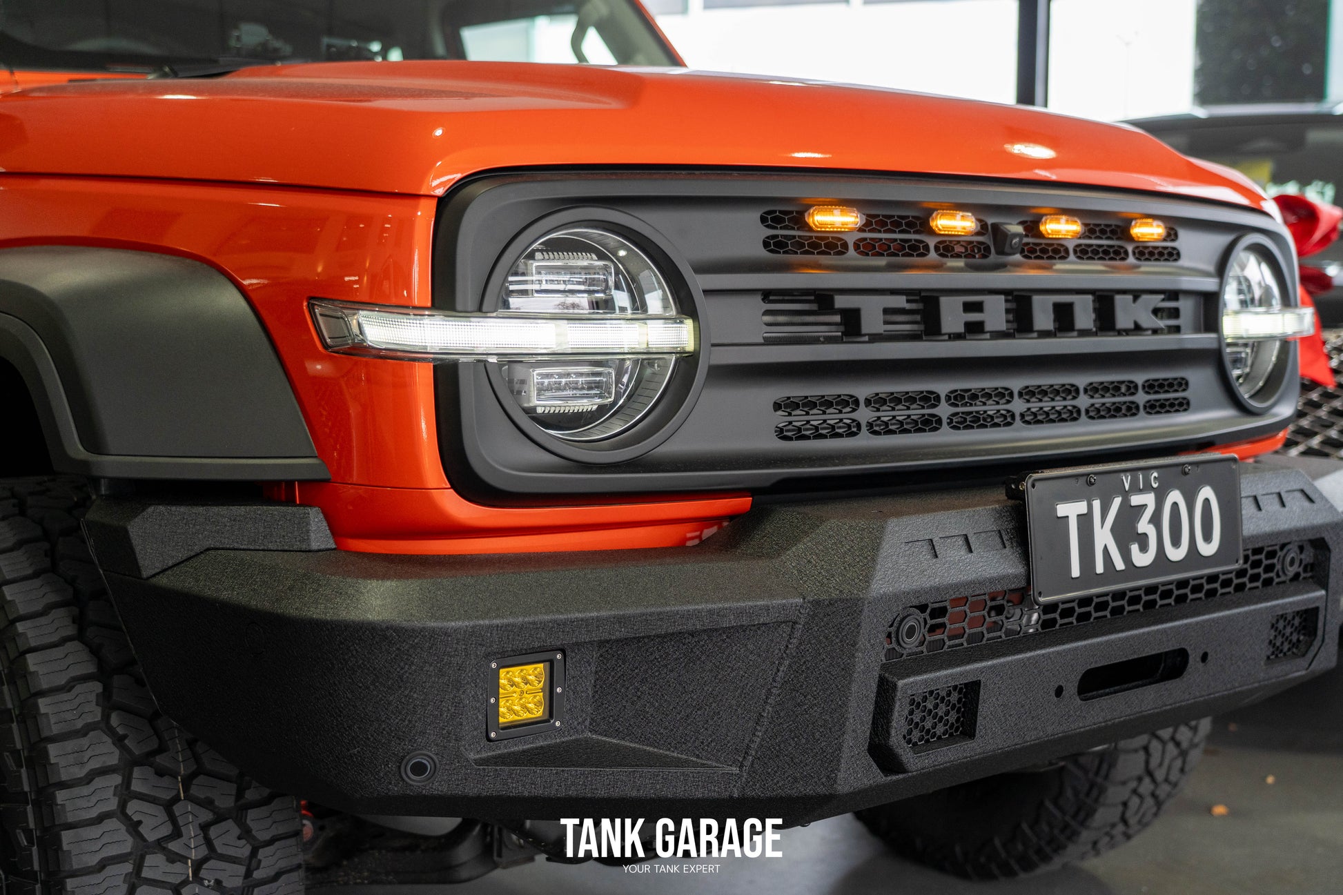 an orange Tank 300 with war god front grill and Front Bumper "Gulfstream"