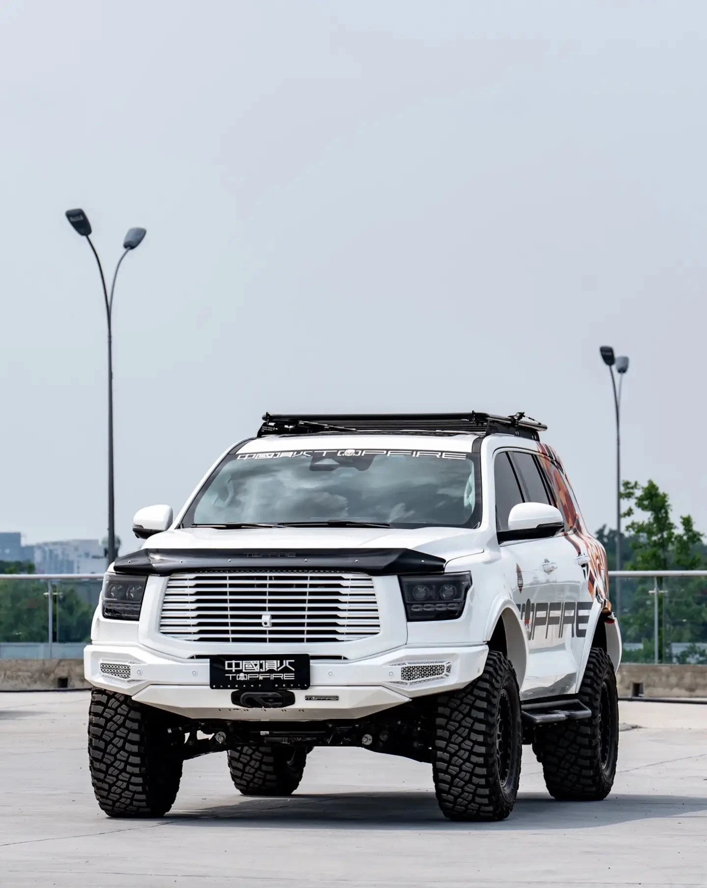 a white tank 500 with top fire roof rack and Hoopless Bullbar "Darkness"